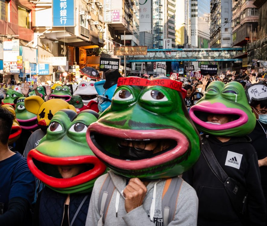 Pro-Democracy demonstrators in Hong Kong wear masks depicting Pepe the Frog.
